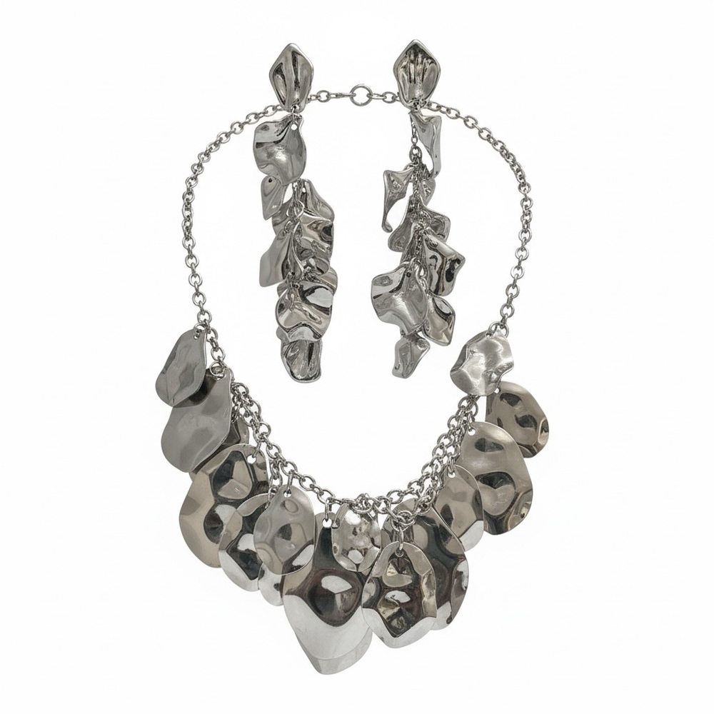 Bold silver-tone statement bib necklace with matching earrings
NWOT